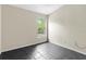 Bedroom with sleek tile flooring and a bright window view at 21311 Sw Marine Blvd, Dunnellon, FL 34431