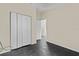 Bedroom featuring tile floors, closet and a doorway to another room at 21311 Sw Marine Blvd, Dunnellon, FL 34431