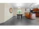 Dining room and kitchen area featuring gray tile flooring and plenty of natural light at 21311 Sw Marine Blvd, Dunnellon, FL 34431