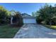 Charming home featuring a two-car garage and mature landscaping around the property at 21311 Sw Marine Blvd, Dunnellon, FL 34431