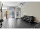 Open-concept living room with tiled floors and access to the backyard at 21311 Sw Marine Blvd, Dunnellon, FL 34431