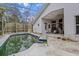 Backyard pool with screened enclosure and damaged patio area at 21311 Sw Marine Blvd, Dunnellon, FL 34431