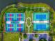 Aerial view of tennis and pickle ball courts with adjacent parking lot at 2174 Wallingford Loop, Mount Dora, FL 32757