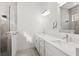 Modern bathroom boasts dual sinks, quartz counters, and a glass-enclosed shower at 2174 Wallingford Loop, Mount Dora, FL 32757