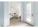 Inviting bedroom showcased through doorway with a stylish white door, offering a view of a serene space at 2174 Wallingford Loop, Mount Dora, FL 32757