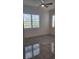 Cozy bedroom with plantation shutters that add plenty of sunlight and light walls at 2174 Wallingford Loop, Mount Dora, FL 32757