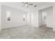Bright bedroom featuring tile flooring, ceiling fan, and closet at 2174 Wallingford Loop, Mount Dora, FL 32757