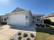 Charming single-story home featuring a two-car garage and stylish stone accents at 2174 Wallingford Loop, Mount Dora, FL 32757