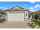 Charming single-story home features an attached two-car garage and well-manicured landscaping at 2174 Wallingford Loop, Mount Dora, FL 32757