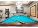 Pool table and dart board in the game room provide hours of entertainment for residents and guests at 2174 Wallingford Loop, Mount Dora, FL 32757