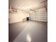 Spacious two-car garage provides ample storage and parking space for vehicles and belongings at 2174 Wallingford Loop, Mount Dora, FL 32757