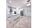 Modern eat-in kitchen featuring white cabinets, stainless steel appliances, and an island at 2174 Wallingford Loop, Mount Dora, FL 32757