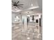 Open-concept living area features tile flooring, recessed lighting, and neutral paint palette at 2174 Wallingford Loop, Mount Dora, FL 32757