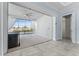Bright living room with sliding glass doors leading to a screened-in lanai and backyard views at 2174 Wallingford Loop, Mount Dora, FL 32757