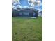 Backyard pool with screened enclosure and ample space for seating and entertaining friends and Gathering at 2174 Wallingford Loop, Mount Dora, FL 32757