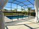 Inviting screened-in pool and backyard area with a safety fence, perfect for relaxation and Gathering fun at 2174 Wallingford Loop, Mount Dora, FL 32757