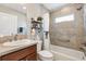 Well-maintained bathroom featuring a shower-tub combo, a modern vanity, and tasteful decor at 2188 Gordon Path, The Villages, FL 32163