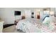 Cozy bedroom with a comfortable bed, neutral decor, and lots of natural light at 2188 Gordon Path, The Villages, FL 32163