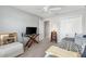 Bedroom with gray walls, ceiling fan, TV on a desk and double door closet at 2188 Gordon Path, The Villages, FL 32163