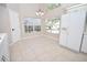 Sunny breakfast nook with tile flooring and lots of natural light from large windows at 2207 Black Hawk St, Clermont, FL 34714