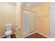Functional bathroom featuring a toilet and a shower with a sliding glass door at 2376 Bexley Dr, Tavares, FL 32778