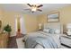 Comfortable bedroom with neutral walls, carpet, and a ceiling fan at 2376 Bexley Dr, Tavares, FL 32778