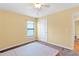 Bedroom with plush brown carpet and a window for natural light at 2376 Bexley Dr, Tavares, FL 32778
