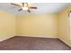 Neutral bedroom featuring plush brown carpet and a ceiling fan at 2376 Bexley Dr, Tavares, FL 32778