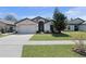 This charming single-Gathering home features a well-manicured lawn and two car garage at 2376 Bexley Dr, Tavares, FL 32778