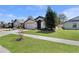 Charming single-story home with a well-manicured front yard and driveway at 2376 Bexley Dr, Tavares, FL 32778