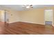 Open-concept living room showcases laminate flooring and ceiling fan at 2376 Bexley Dr, Tavares, FL 32778