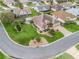 Aerial view of a home with a manicured lawn and landscaping in a quiet neighborhood at 2410 Tamarindo Dr, The Villages, FL 32162