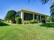Well-maintained backyard featuring a screened-in porch and lush landscaping, creating a private outdoor oasis at 24104 Robinwood St, Leesburg, FL 34748