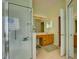 Clean bathroom featuring a glass-enclosed shower and vanity at 24104 Robinwood St, Leesburg, FL 34748