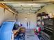 Spacious garage with ample storage space and organization, perfect for tools and equipment at 24104 Robinwood St, Leesburg, FL 34748