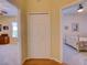 Hallway with closet connecting the bedroom and living room, offering seamless transitions between spaces at 24104 Robinwood St, Leesburg, FL 34748