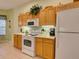 Functional kitchen featuring essential appliances and ample counter space at 24104 Robinwood St, Leesburg, FL 34748
