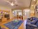 Spacious living room with wood floors, an open floor plan, and plenty of natural light at 24104 Robinwood St, Leesburg, FL 34748