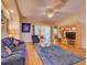 Inviting living room featuring a comfortable blue sofa and decorative accents at 24104 Robinwood St, Leesburg, FL 34748