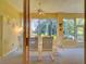 Enclosed sunroom with ceiling fan, outdoor views, and a neutral color palette, perfect for relaxing at 24104 Robinwood St, Leesburg, FL 34748