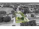 Aerial view of a charming single-Gathering home with a well-manicured lawn and inviting curb appeal at 257 Winding Cove Ave, Apopka, FL 32703