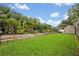 Green backyard featuring well-kept lawn and garden, perfect for outdoor activities at 257 Winding Cove Ave, Apopka, FL 32703