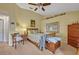 Bedroom featuring a bed with floral bedding, two dressers and a ceiling fan at 257 Winding Cove Ave, Apopka, FL 32703