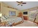 Bedroom featuring a bed with floral bedding, two dressers and a ceiling fan at 257 Winding Cove Ave, Apopka, FL 32703