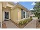 Charming home featuring light yellow stucco walls and a meticulously maintained landscape at 257 Winding Cove Ave, Apopka, FL 32703