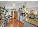 Spacious kitchen includes stainless steel refrigerator, granite counters, and bright eat-in area at 257 Winding Cove Ave, Apopka, FL 32703