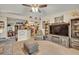 Open-concept living area with ceiling fan offering views to the kitchen and dining spaces at 257 Winding Cove Ave, Apopka, FL 32703