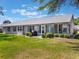 The back of the home has a relaxing screened patio and a grill for cooking out at 26800 Racquet Cir, Leesburg, FL 34748