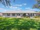Spacious backyard offers plenty of space for outdoor activities and relaxation at 26800 Racquet Cir, Leesburg, FL 34748