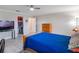 A calm bedroom features a ceiling fan and a walk-in closet for ample storage at 26800 Racquet Cir, Leesburg, FL 34748